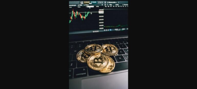 Best crypto exchanges 2026 - gold Bitcoin coins on a laptop keyboard with a trading chart